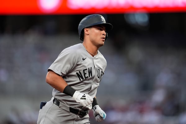 New York Yankees' Anthony Volpe (11) rounds the bases after hitting a two-run home run against the Atlanta Braves inning of a baseball game, Saturday, July 19, 2025, in Atlanta. (AP Photo/Mike Stewart)