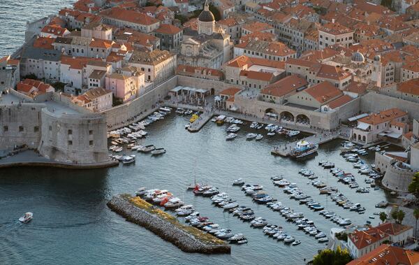FILE -This Sept. 4, 2018 photo shows the harbor in the old town of Dubrovnik from a hill above the city. (AP Photo/Darko Bandic, File)