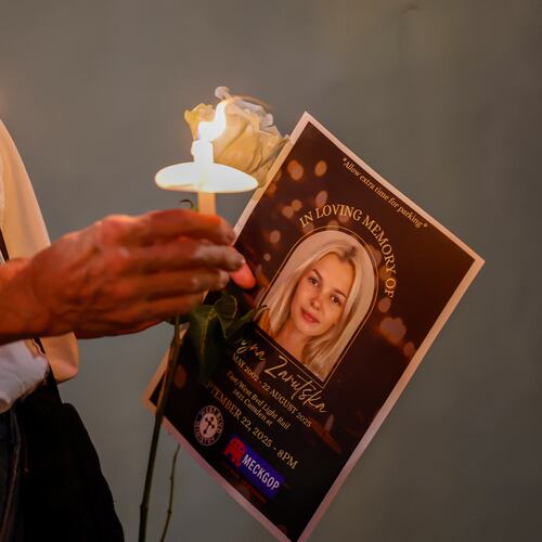 FILE - Community members hold candles as they gather for a vigil honoring the life of Iryna Zarutska, who was fatally stabbed on a commuter train, Sept. 22, 2025, in Charlotte, N.C. (AP Photo/Nell Redmond, File)