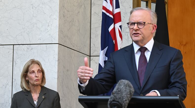 Jillian Siegel, Special Envoy to Combat Antisemitism in Australia listens to Prime Minister Anthony Albanese speak to the media during a press conference at Parliament House in Canberra, Australia, Thursday, Jan. 8, 2026. (Lukas Coch/AAP Image via AP)
