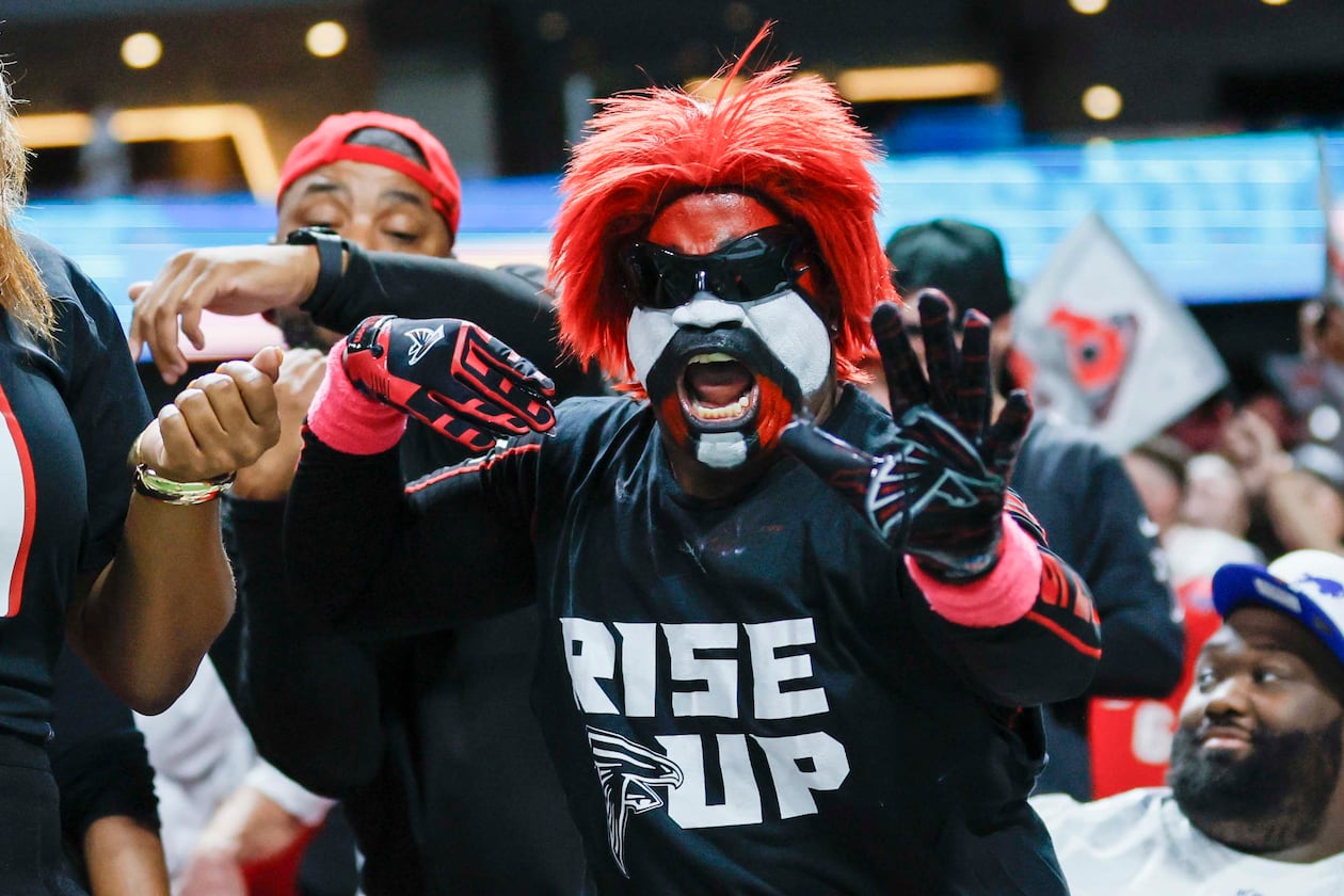 A Falcons fan reacts after Atlanta makes a field goal during the second half against the Bills on Monday, Oct. 13, 2025, at Mercedes-Benz Stadium in Atlanta. (Miguel Martinez/AJC)