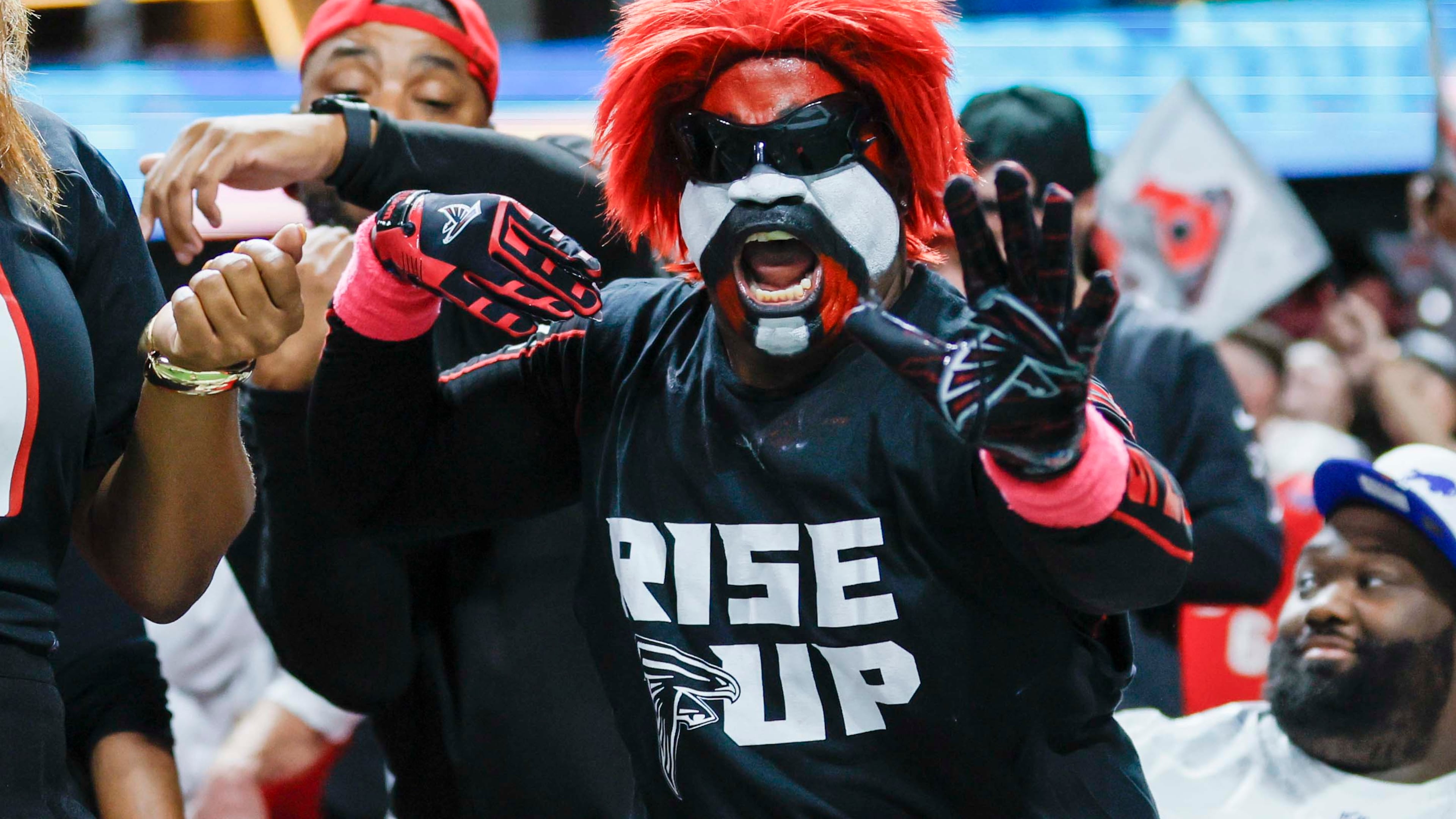 A Falcons fan reacts after Atlanta makes a field goal during the second half against the Bills on Monday, Oct. 13, 2025, at Mercedes-Benz Stadium in Atlanta. (Miguel Martinez/AJC)