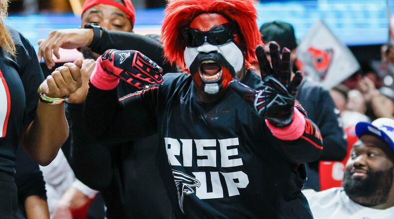 A Falcons fan reacts after Atlanta makes a field goal during the second half against the Bills on Monday, Oct. 13, 2025, at Mercedes-Benz Stadium in Atlanta. (Miguel Martinez/AJC)