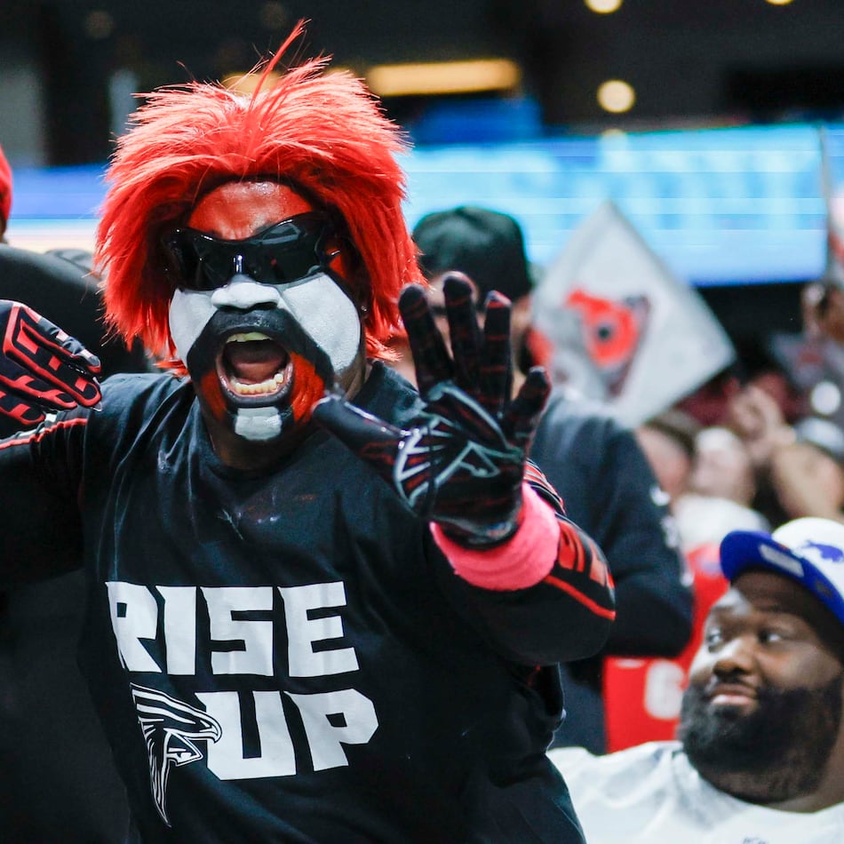 A Falcons fan reacts after Atlanta makes a field goal during the second half against the Bills on Monday, Oct. 13, 2025, at Mercedes-Benz Stadium in Atlanta. (Miguel Martinez/AJC)