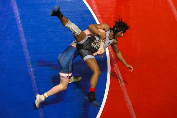 Jefferson’s Cruz Hezel picks up Dougherty’s Elijah Caudle during the Class 3A 150 lb weight class during round of 16 of the GHSA Traditional Wrestling Championship at The Arena at Southlake in Morrow on Feb. 11, 2026. Jefferson’s Hezel won 19-2. (Jason Getz/AJC)