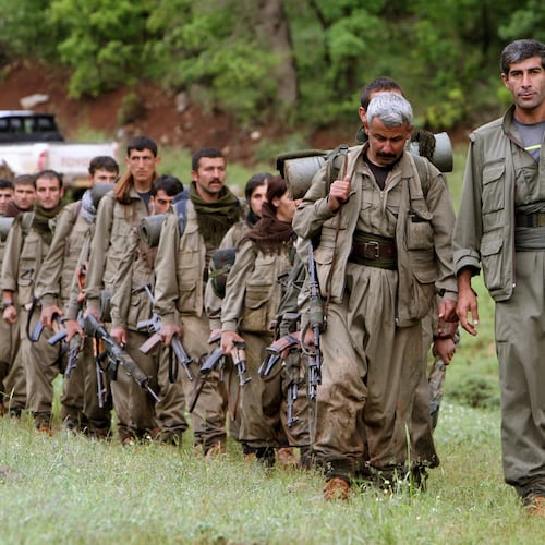 FILE - A group of armed Kurdish fighters from the Kurdistan Workers Party (PKK) enter northern Iraq in the Heror area, northeast of Dahuk, 260 miles (430 kilometers) northwest of Baghdad, Iraq, May 14, 2013. (AP Photo/Ceerwan Aziz, File)