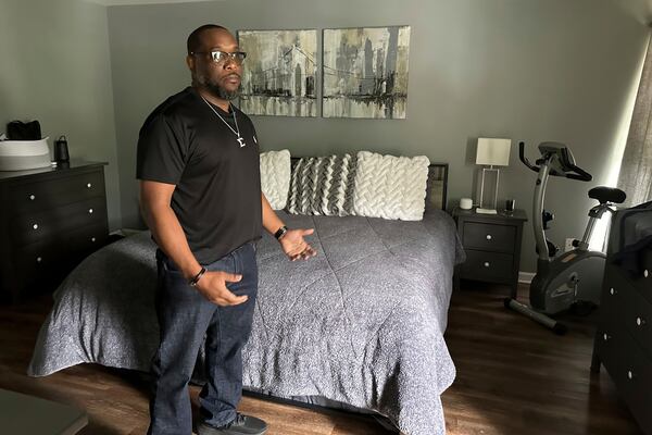 File - Toi Cliatt talks about the raid in the bedroom where he and then-girlfriend Trina Martin were sleeping when the FBI broke into their home, in Atlanta, April 25, 2025. (AP Photo/Sudhin Thanawala, File)