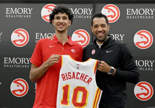 Now-fired Hawks general manager Landry Fields (right) with 2024 No. 1 overall draft pick Zaccharie Risacher.