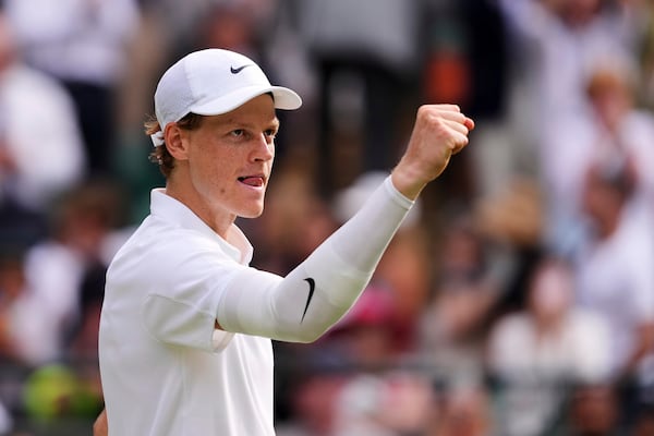 Jannik Sinner of Italy celebrates winning the men's singles quarter final match against Ben Shelton of the U.S. at the Wimbledon Tennis Championships in London, Wednesday, July 9, 2025.(AP Photo/Kirsty Wigglesworth)