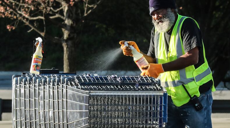 April 3, 2020 DeKalb County: Sam's Club workers sanitized shopping carts as customers lined up over the length of a football field at Samâs Club located at 2901 Clairmont Rd in DeKalb County on Friday, April3, 2020. Chamblee police had an officer on site to monitor the crowd which was being let into the store in lower numbers to retain social distancing. The novel coronavirus is maintaining a firm grip on Georgia as state health officials on Friday reported 387 new cases and a growing death toll. The latest data from the Georgia Department of Public Health shows 5,831 confirmed cases, an increase of about 7% from the 5,444 cases reported Thursday night. Eight more Georgians have died as a result of COVID-19, the disease caused by the virus, bringing the stateâs total to 184. The youngest victim in Georgia was an 11-year-old DeKalb County boy with an underlying health condition, according to officials. Since Thursday night, commercial and state laboratories have conducted 2,308 new tests. Of those who have tested positive since the beginning of the outbreak, 1,158 are in hospitals, according to the health department. Those numbers are predicted to grow even further in coming weeks as plans are put into place to increase daily testing capacity. Scientific projections suggest the state will see thousands of new cases and hundreds of additional deaths before the virus is contained, AJC.com previously reported. Growing concerns about the worsening COVID-19 outbreak prompted Gov. Brian Kemp to issue a statewide stay-at-home order. The executive order will go into effect at 6 p.m. Friday and will last through at least April 13. JOHN SPINK/JSPINK@AJC.COM