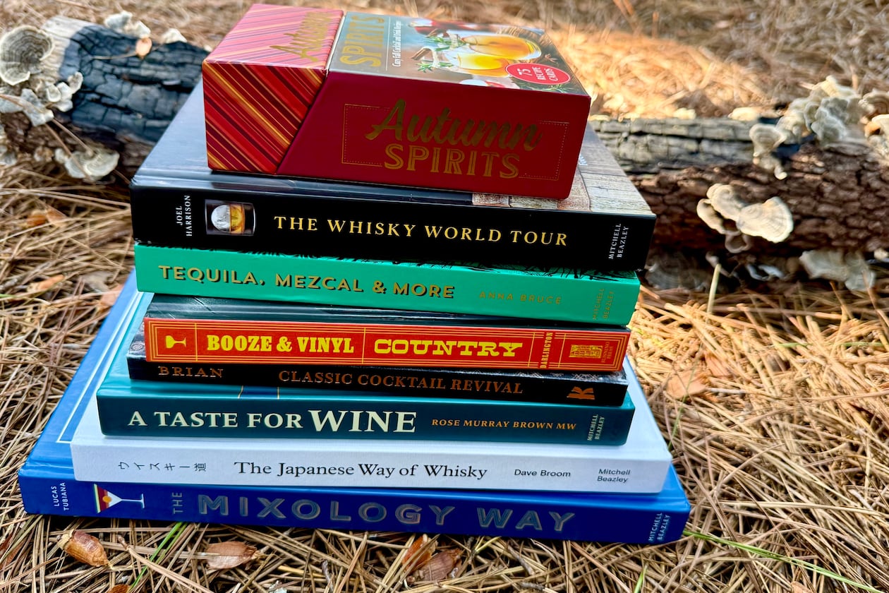 Fall 2025 offers exciting new drink books on whisky, wine and mixing classic cocktails at home. (Angela Hansberger for the AJC)