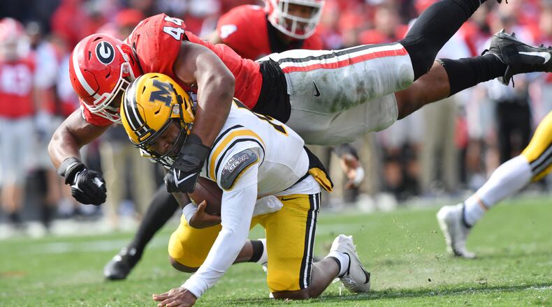 Missouri's quarterback Tyler Macon (10) is sacked by Georgia's defensive lineman Travon Walker (44) in the second half during a NCAA football game at Sanford Stadium in Athens on Saturday, November 6, 2021. Georgia won 43-6 over Missouri. (Hyosub Shin / Hyosub.Shin@ajc.com)