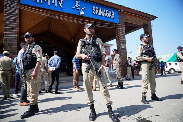 Security personnel stand guard outside the Srinagar railway station, from where Vande Bharat Express train is soon to be inaugurated to run between Srinagar and Katra, in Srinagar, Indian controlled Kashmir, Friday, June 6, 2025. (AP Photo/Dar Yasin)