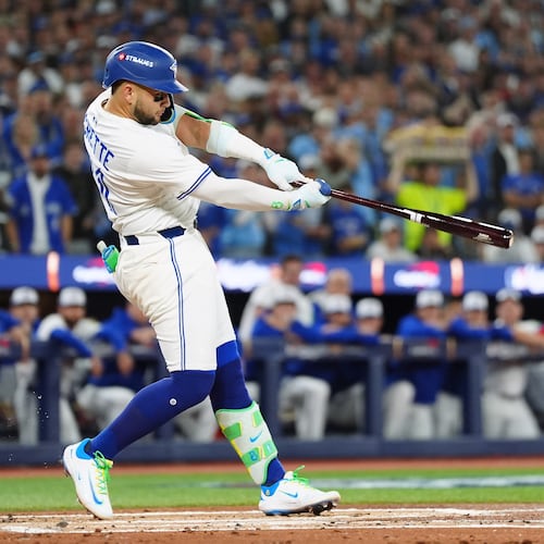 Toronto Blue Jays' Bo Bichette hits a single against the Los Angeles Dodgers during the first inning of Game 1 of baseball's World Series, Friday, Oct. 24, 2025, in Toronto. (Frank Gunn/The Canadian Press via AP)