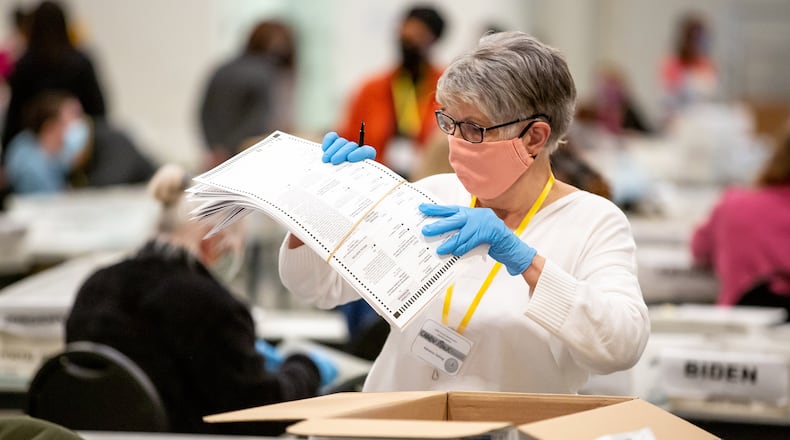Cobb County election staff continue to recount the presidential ballots Monday at the Jim Miller Park Event Center in Marietta on November 16, 2020. STEVE SCHAEFER / SPECIAL TO THE AJC