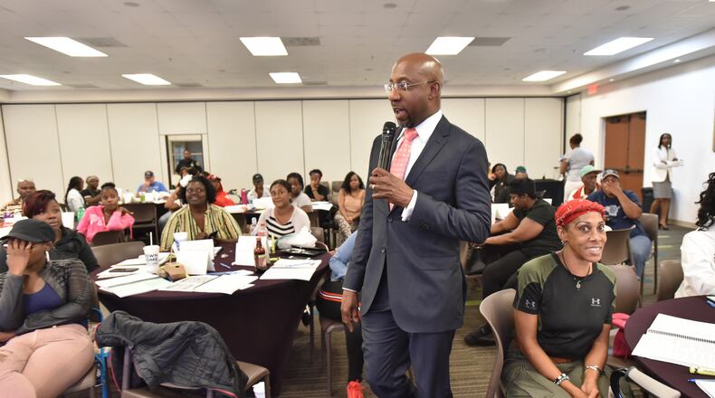 July 18, 2019 Atlanta - Rev. Raphael Warnock speaks to program participants during Good Neighbor Program at the Historic Ebenezer Baptist Church on Thursday, July 18, 2019. The Rev. Raphael G. Warnock has had busy couple of weeks. After co-hosting a conference on ending mass incarceration in the United States, he was off to Baltimore. And less than 24 hours ago, he was back at Ebenezer for the 45th annual scholarship concert honoring the memory of the late Christine Williams King, affectionately known as Mama King, who was assassinated there 45 years ago. (Hyosub Shin / Hyosub.Shin@ajc.com)