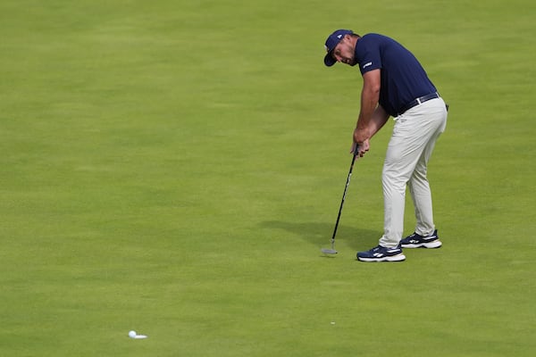 Bryson DeChambeau of the United States putts on the 18th green during the final round of the British Open golf championship at the Royal Portrush Golf Club, Northern Ireland, Sunday, July 20, 2025. (AP Photo/STR)
