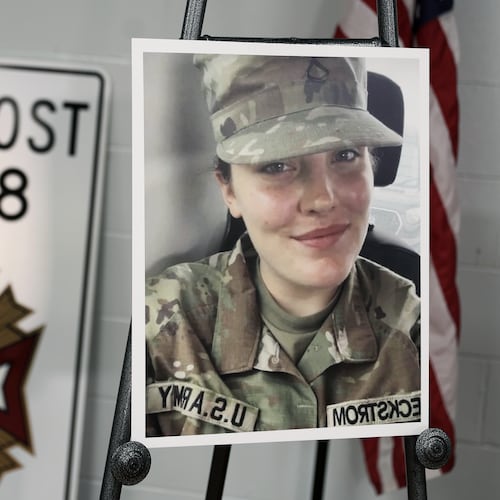 A photo is displayed of National Guard member Specialist Sarah Beckstrom, one of two National Guard members who were shot in Washington on Wednesday, in Webster Springs, W.Va., Friday, Nov. 28, 2025. (AP Photo/Kathleen Batten)