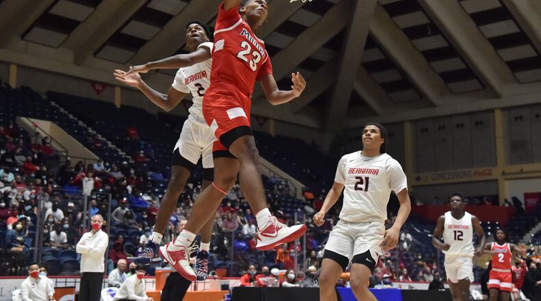 March 13, 2021 Macon - Milton's Kendall Campbell (23) gets a shot off past Berkmar's Jermahri Hill (2) during the 2021 GHSA State Basketball Class AAAAAAA Boys Championship game at the Macon Centreplex in Macon on Saturday, March 13, 2021 Milton won 52-47 over Berkmar. (Hyosub Shin / Hyosub.Shin@ajc.com)