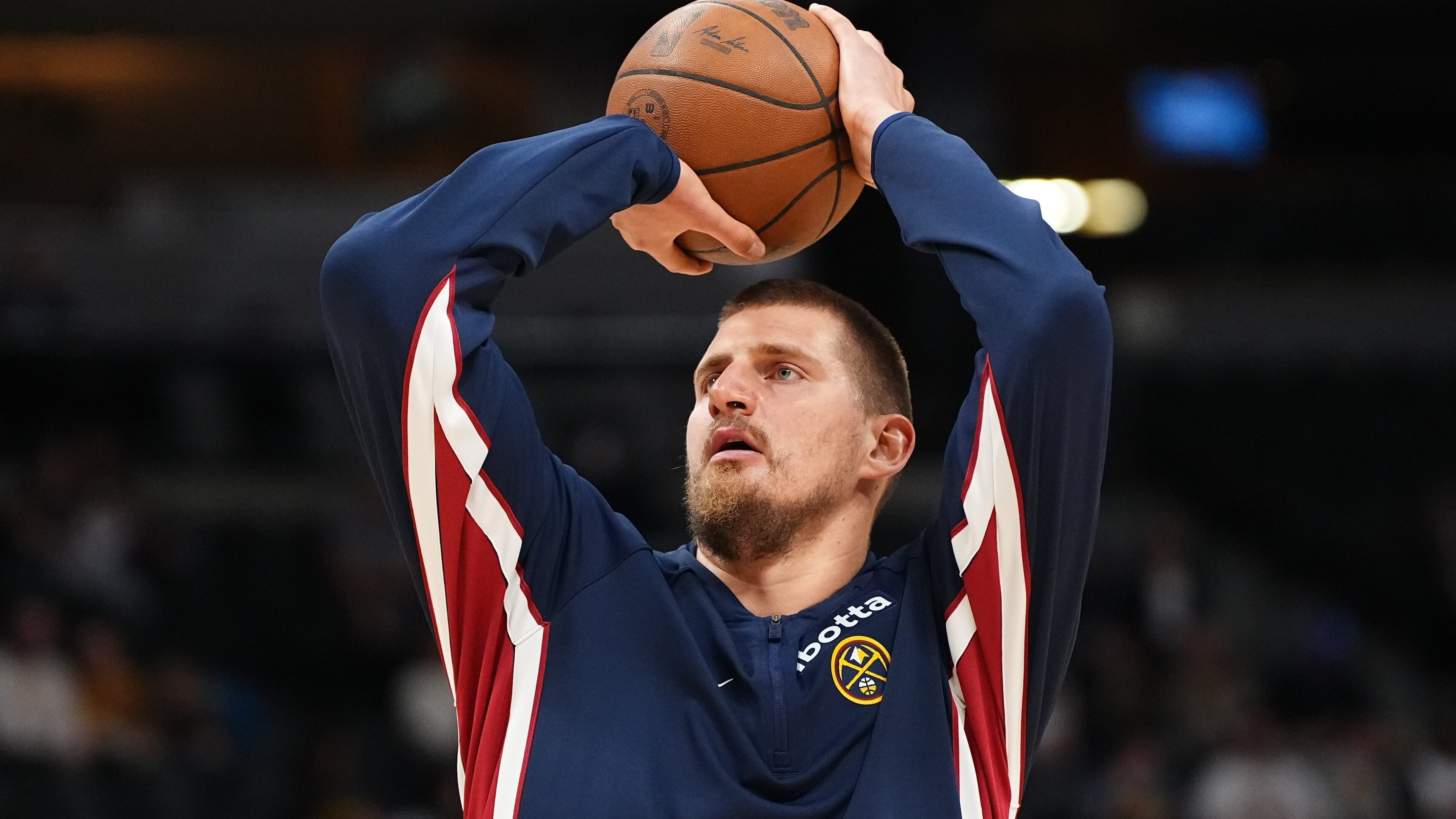 Denver Nuggets center Nikola Jokić warms up before a preseason NBA basketball game against the Chicago Bulls, Tuesday, Oct. 14, 2025, in Denver. (AP Photo/Jack Dempsey)