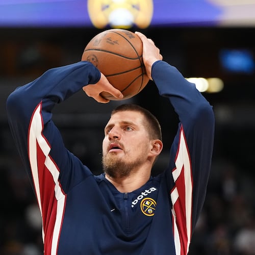 Denver Nuggets center Nikola Jokić warms up before a preseason NBA basketball game against the Chicago Bulls, Tuesday, Oct. 14, 2025, in Denver. (AP Photo/Jack Dempsey)