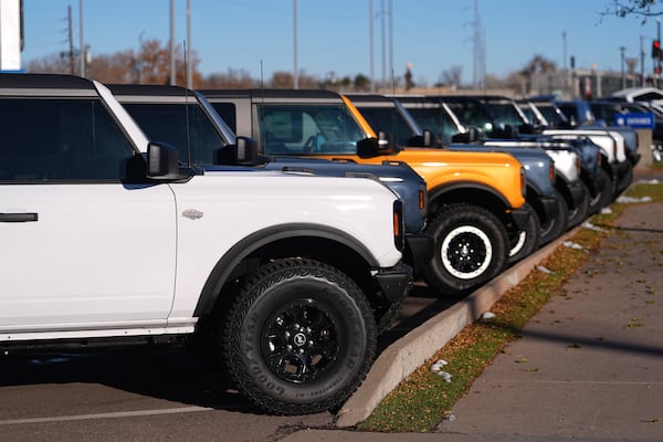 FILE - A long line of unsold 2024 Bronco utility vehicles sit on display at Ford dealership in Denver, Nov. 28, 2024. (AP Photo/David Zalubowski, File)