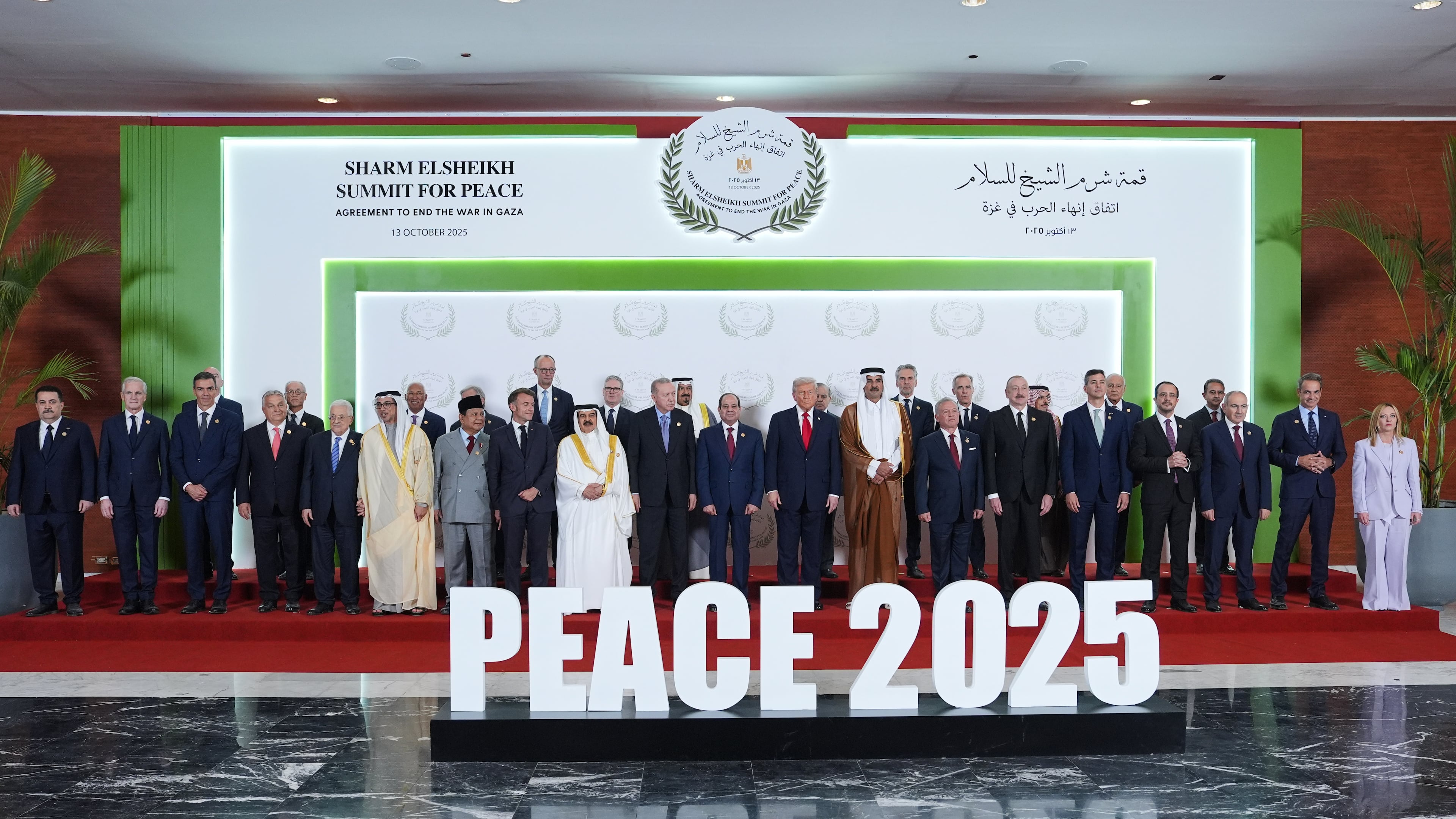 President Donald Trump and other world leaders pose for a photo during a summit to support ending the more than two-year Israel-Hamas war in Gaza after a breakthrough ceasefire deal, Monday, Oct. 13, 2025, in Sharm El Sheikh, Egypt. (AP Photo/Evan Vucci, Pool)