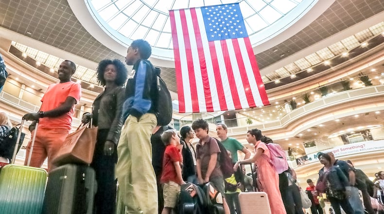 June 29, 2023 Atlanta: Travelers came ready to fly on Friday, June 29, 2023 and was a busy day for security queues at Hartsfield-Jackson International Airport. More than 103,000 departing passengers were expected to pass through TSA checkpoints surpassing the record set on the Monday after the Super Bowl in Atlanta in 2019, said Robert Spinden, TSA’s federal security director in Atlanta. The July 4 holiday period will bring more travelers not just to airports, but also on the highways. AAA said it expects a record 1.6 million people in Georgia to travel for the period running from June 30 through July 4, most of them going by car. Travelers should “expect to see congested roads, busy hotels, and long lines at airports and attractions,” said Debbie Haas, AAA’s vice president of travel, in a written statement. Nationally, the auto club expects 43.2 million people will take road trips and a record 4.17 million people will fly for Independence Day travel. Heavy crowds at the world’s busiest airport throughout the holiday period from Thursday through July 6 will mean long lines and wait times at airport security checkpoints during peak times. Most planes will be full or nearly full. The busiest days are expected to be Thursday and Friday. Total traffic including connecting passengers at the Atlanta airport, is expected to total more than 350,000 on Thursday and nearly 370,000 on Friday. (John Spink / John.Spink@ajc.com)