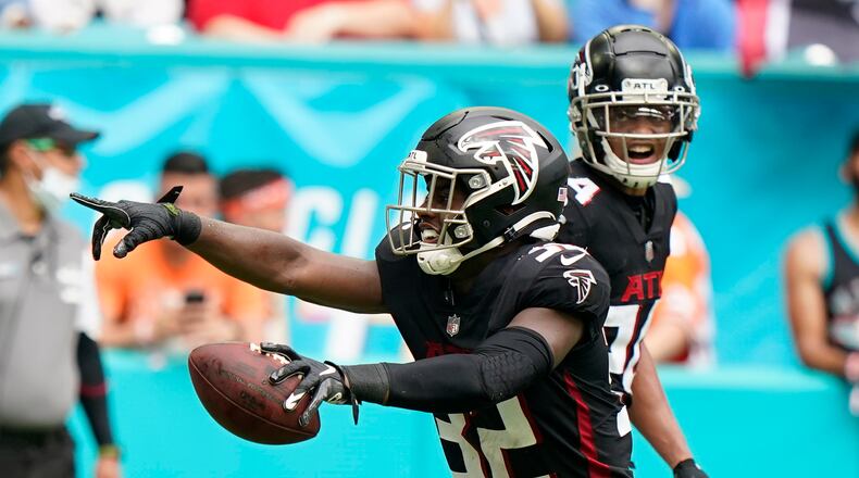 Atlanta Falcons safety Jaylinn Hawkins (32) reacts after intercepting a pass in the endzone intended for Miami Dolphins tight end Durham Smythe during the first half of an NFL football game, Sunday, Oct. 24, 2021, in Miami Gardens, Fla. (AP Photo/Wilfredo Lee)