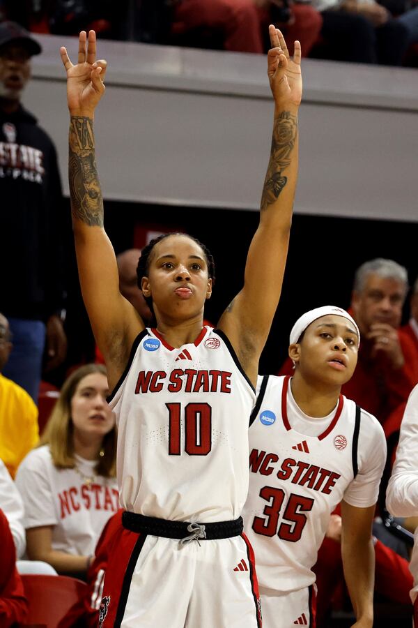 North Carolina State's Aziaha James (10) celebrates on the sideline during the second half against Michigan State in the second round of the NCAA college basketball tournament in Raleigh, N.C., Monday, March 24, 2025. (AP Photo/Karl DeBlaker)