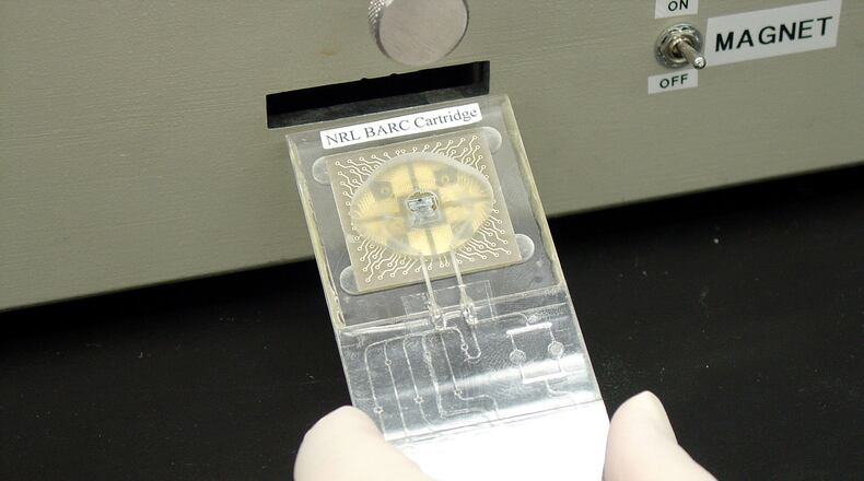 Medical research now spans everything from the basic functioning of organisms to high-tech computer systems. Shown here is biosensor equipment developed several years ago with funding from a CIA arm to detect antibodies and DNA in blood samples. (PHOTO: U.S. Naval Research Laboratory)