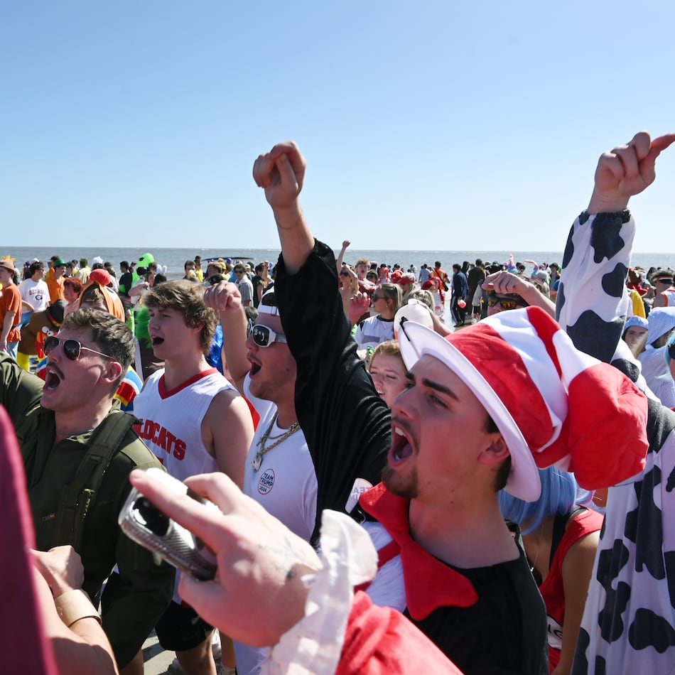 Thousands of UGA students enjoy during the annual “Frat Beach” party for the weekend of the Georgia-Florida football game on St. Simons Island, Friday, November 1, 2024. On the weekend of the Georgia-Florida football game, St. Simons Island’s East Beach becomes “Frat Beach,” an open-air party teeming with thousands of highly inebriated college students. (Hyosub Shin / AJC)