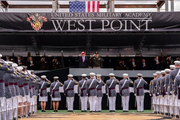 President Donald Trump salutes alongside Lieutenant General Steven W. Gilland during the U.S. Military Academy commencement ceremonies in West Point, N.Y., Saturday, May 24, 2025. (AP Photo/Adam Gray)