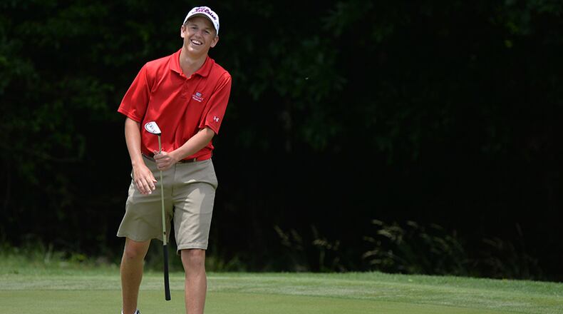 Andrew Orischak, a high school freshman from Hilton Head, S.C., laughs off barley missing his par putt on the 11th hole during the second round of the U.S. Open Sectional Qualifier Monday June 2, 2014, at Ansley Golf Club. Norlander is going to the U.S. Open, his first major, after finishing low man in sectional qualifying.