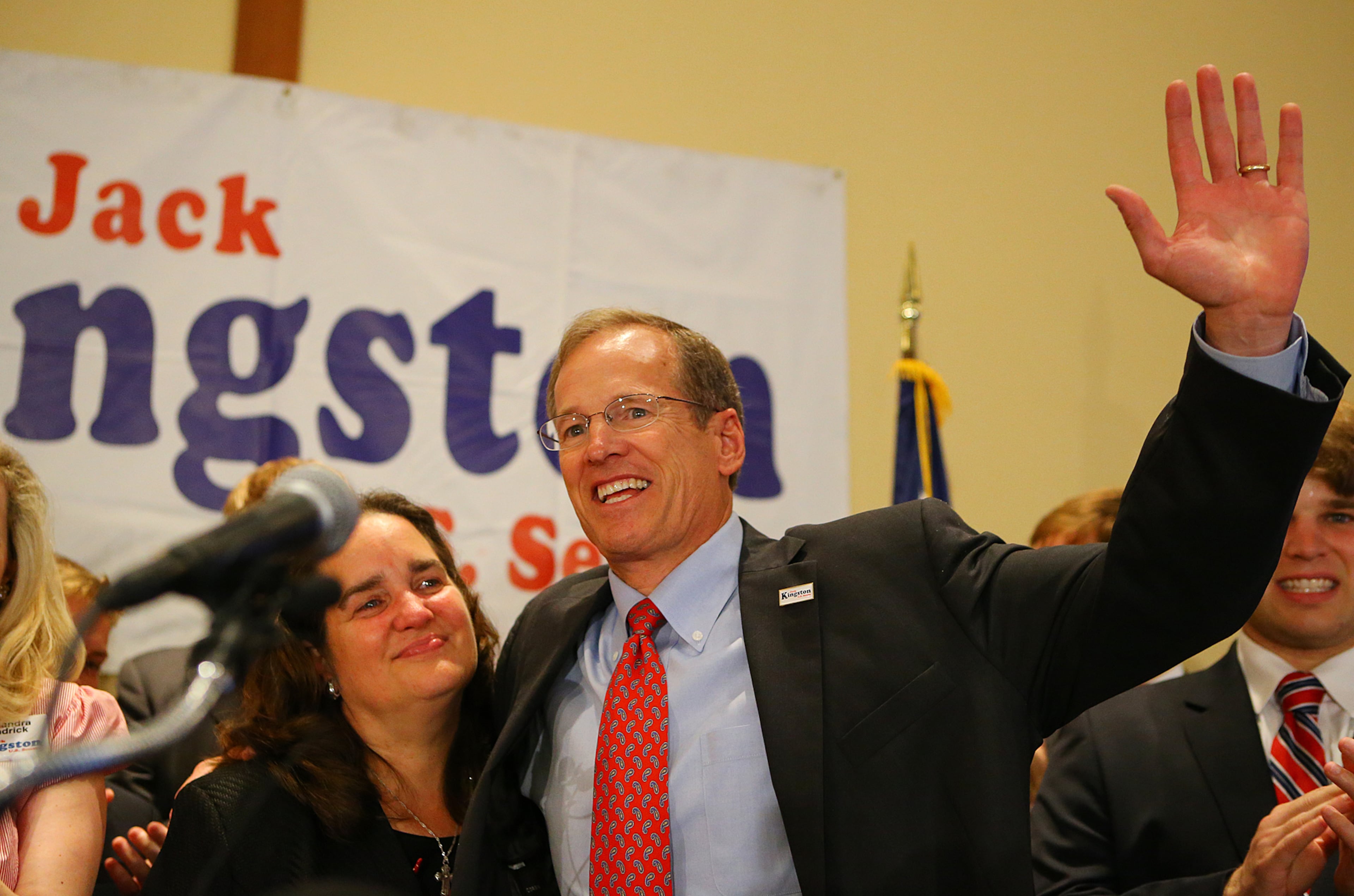 In this AJC file photo, former U.S. Rep. Jack Kingston hugs his wife, Libby, and waves to supporters at the end of his address conceding defeat to David Perdue at his election night party at the Georgia Tech Hotel & Conference Center on July 22, 2014, in Atlanta. (Curtis Compton/AJC)