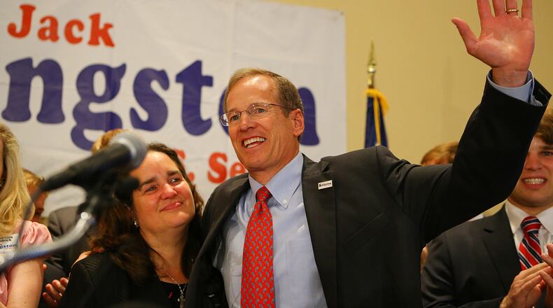 072214 ATLANTA: U.S. Senate candidate Jack Kingston hugs his wife Libby and waves to supporters at the end of his address conceding defeat to David Perdue at his election night party at the Georgia Tech Hotel & Conference Center on Tuesday, July 22, 2014, in Atlanta.   CURTIS COMPTON / CCOMPTON@AJC.COM
