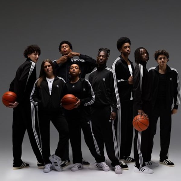Rising seniors Kate Harping of Marist (second from left) and Caleb Holt of Grayson (second from right) are among eight high school basketball players to sign NIL deals with Adidas.