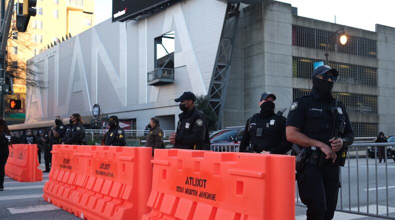 Barricades greeted NBA fans at Marietta Street and Centennial Olympic Park Drive on Sunday. (Photo: Ben Gray / For the AJC)