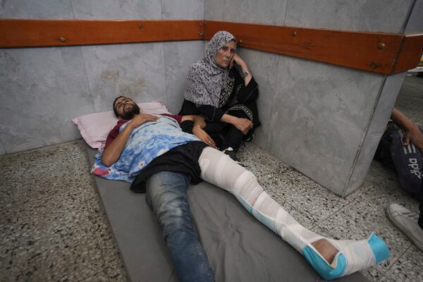Mahmoud Al-Hosary is brought to Shifa Hospital in Gaza City after being injured on his way to an aid distribution center, Thursday, July 3, 2025. (AP Photo/Jehad Alshrafi)