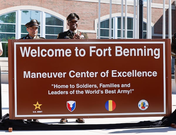 The Maneuver Center of Excellence command team unveils the Fort Benning sign during a renaming ceremony on Wednesday, April 16, 2025. (Natrice Miller/AJC)
