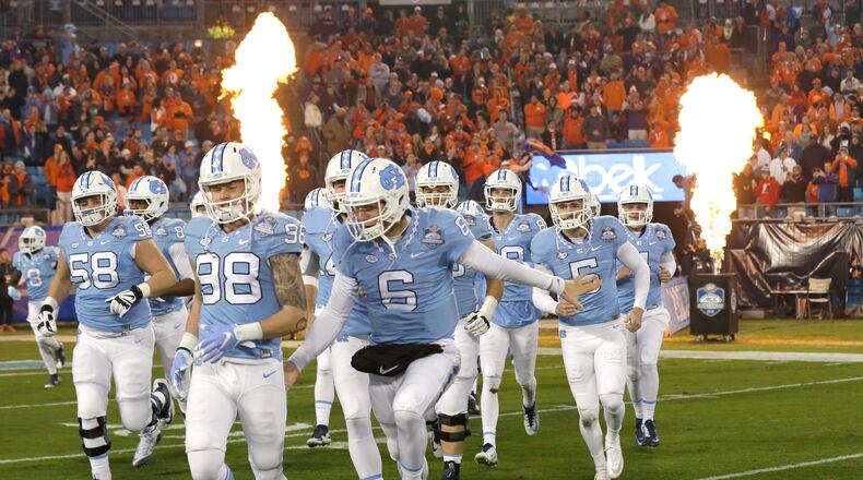 North Carolina takes the field prior to the Atlantic Coast Conference championship NCAA college football game against Clemson in Charlotte, N.C., Saturday, Dec. 5, 2015. (AP Photo/Gerry Broome)