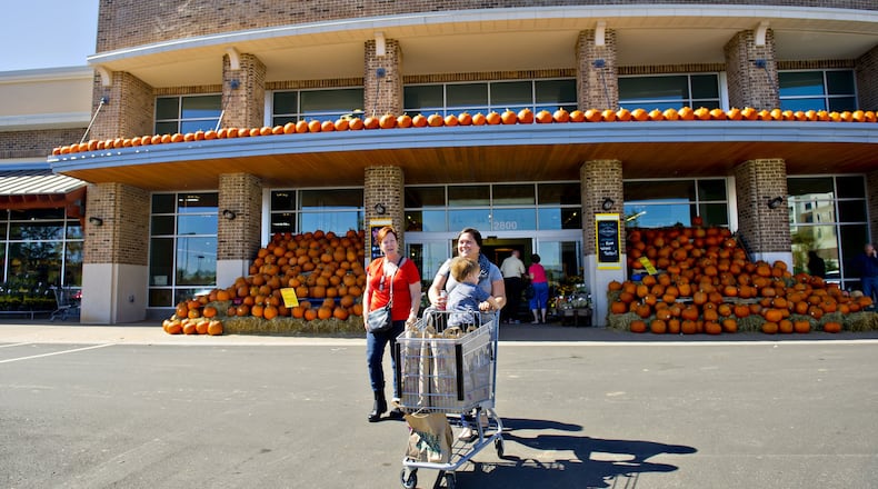 Shoppers leave a Whole Foods Market at the Avalon development in Alpharetta in 2014. JONATHAN PHILLIPS / SPECIAL