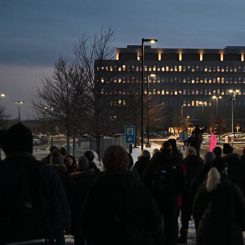 Protesters gather outside the Bishop Henry Whipple Federal Building, Thursday, Jan. 8, 2026, in Minneapolis, Minn. (AP Photo/Tom Baker)