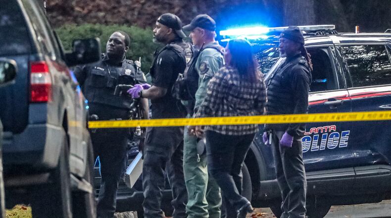 Authorities investigate after a man was found shot multiple times and killed Thursday morning, Oct. 13, 2022 in the driveway of a Buckhead home. The victim, later identified as Christopher Eberhart, 57, was spotted shortly before 8 a.m. in the 1200 block of Peachtree Battle Avenue. (John Spink / John.Spink@ajc.com)