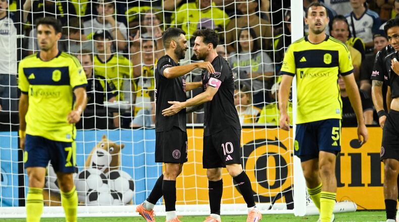 Inter Miami forward Lionel Messi (10) celebrates his goal with defender Jordi Alba, second from left, as Nashville SC midfielder Gastón Brugman (7) and defender Jack Maher (5) walk away during the second half of a MLS soccer match Saturday, Oct. 28, 2025, in Nashville, Tenn. (AP Photo/John Amis)