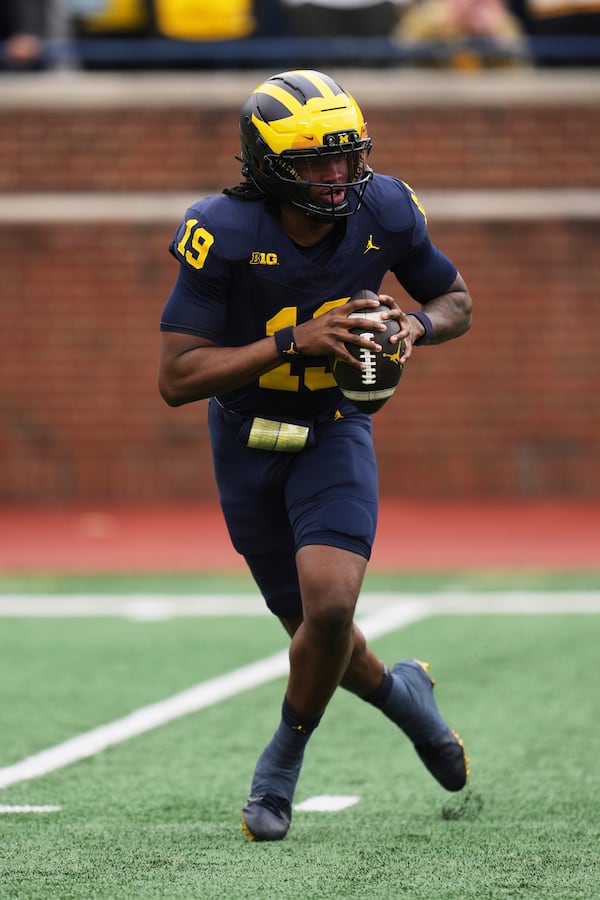 Michigan quarterback Bryce Underwood throws during an NCAA college football spring game in Ann Arbor, Mich., Saturday, April 19, 2025. (AP Photo/Paul Sancya)