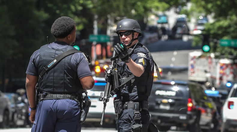 Atlanta police and other law enforcement agencies swarmed Midtown Atlanta on Wednesday after five people were shot.