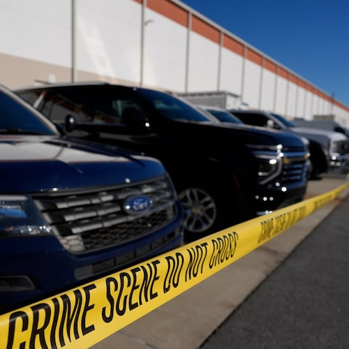 FILE - Crime scene tape is seen as FBI agents search at the Fulton County Election Hub and Operation Center, Jan. 28, 2026, in Union City, Ga., near Atlanta. (AP Photo/Mike Stewart, File)