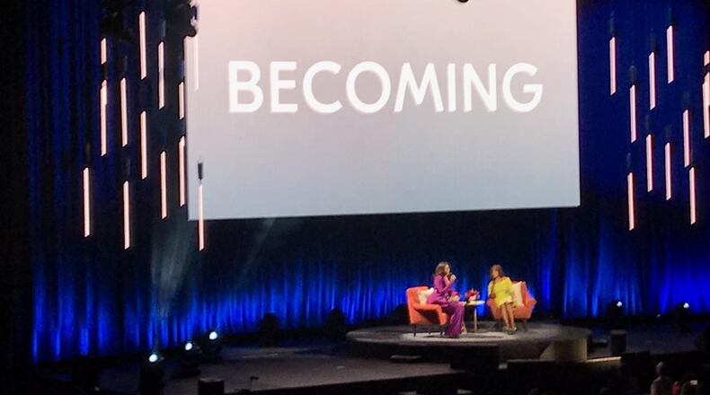 Former first lady Michelle Obama and TV journalist Gayle King, who served as moderator, took the stage on Saturday night, May 11, 2019, at State Farm Arena in Atlanta to discuss Obama's memoir, “Becoming.” (Photo: TYLER ESTEP / AJC)