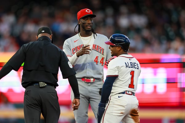 Braves second baseman Ozzie Albies talks with Reds shortstop Elly De La Cruz.